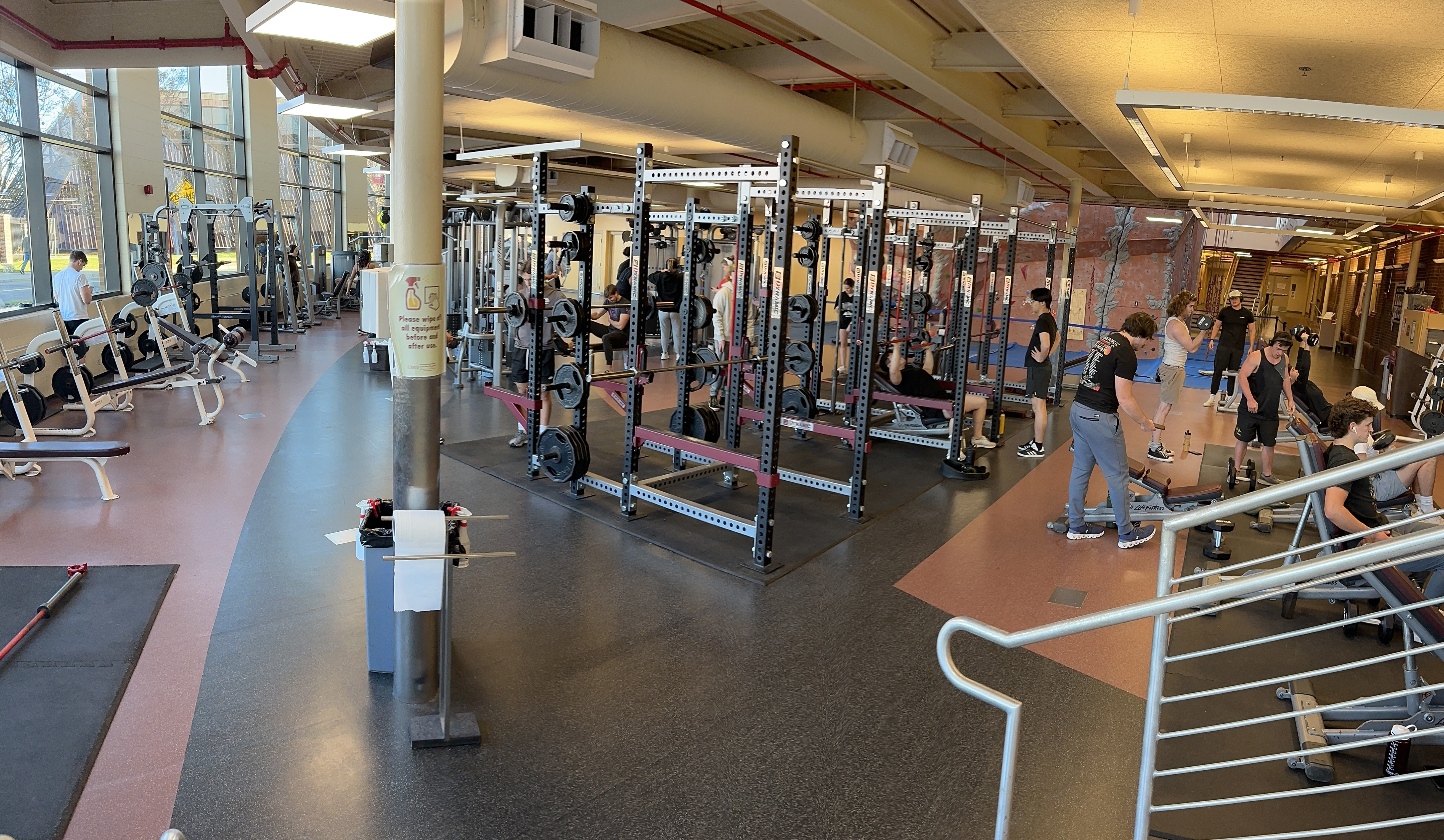 students lifting in a weightroom